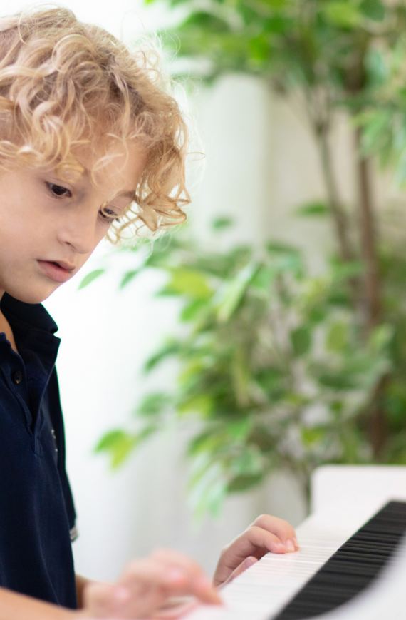 franklin music academy boy pianist - best age to start music lessons